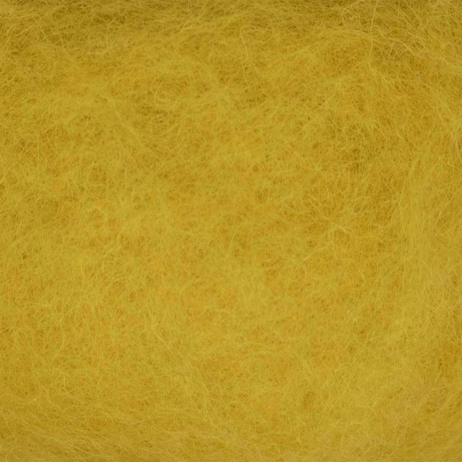 A swatch of yellow carded wool batting for crafting close up