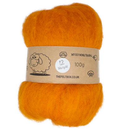 A carded wool batt in orange, weighing 100g, with a label that includes a sheep graphic and product information.