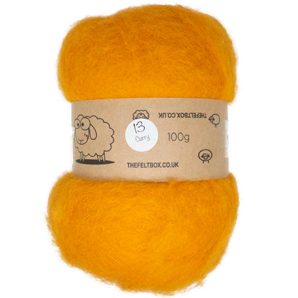 A roll of carded New Zealand wool in curry color, from The Felt Box UK.