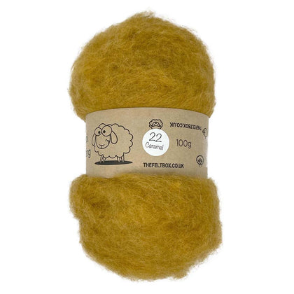 A bundle of carded NZ wool in caramel color, intended for needle felting, displayed with a label indicating 100% wool and the brand 'TheFeltBox.co.