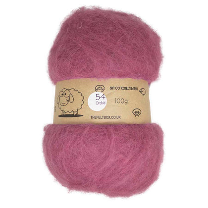 A carded wool batt in orchid pink color, packaged in a felt box branded with the product details.