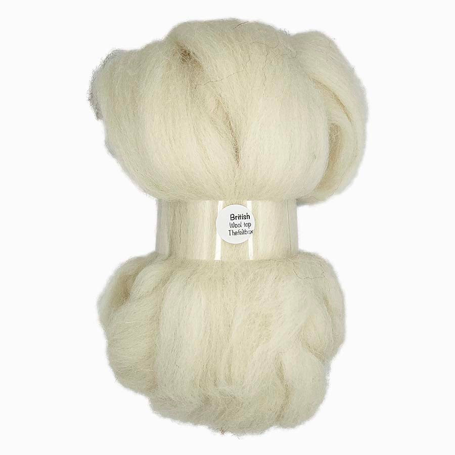Ball of cream-colored yarn with a label on a white background