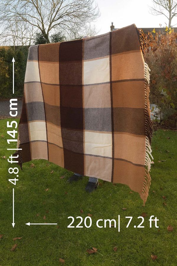 Brown checkered blanket on grass with measurements indicated