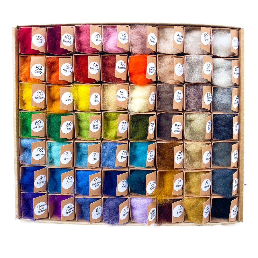 A palette of 56 carded wool colors for needle felting and wool painting, conveniently packaged in a box.