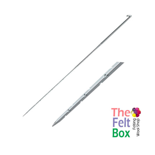 A long, thin metal structuring needle for felting, with a triangular gauge, displayed alongside its packaging box with the brand 'The Felt Box' visible.