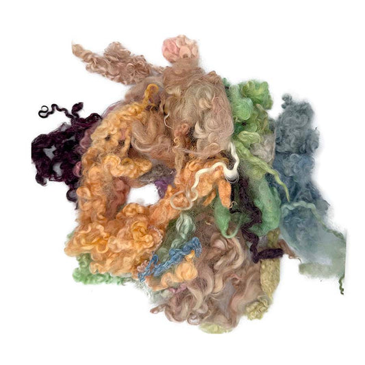 Assorted dyed curly wool locks in orange, green, blue and natural shades