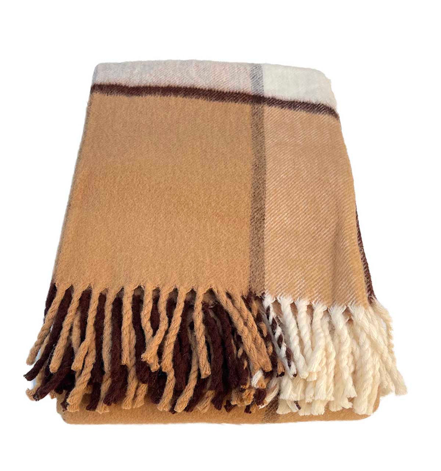 woolen brown throw in brown tartan style detail of tassel shown