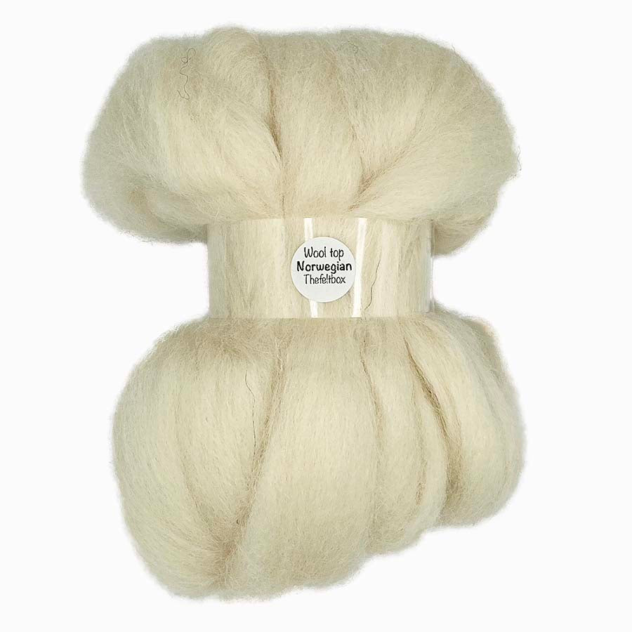 Close-up of Norwegian cream wool top, showing soft fibres with a slightly coarse, natural texture in a warm cream shade, suitable for needle felting, spinning, and craft work