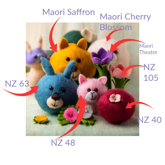 Three needle-felted spring animals made from carded wool balls — a pink cat, blue rabbit and yellow mouse