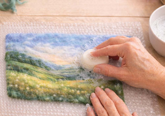 Wet felting beginner landscape with hands, bubble wrap and soapy water
