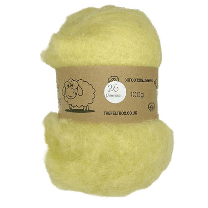 A carded wool batt in a natural pale color, wrapped in a brown paper packaging with a label that includes the brand name, product type, weight, and an illustration of a sheep.