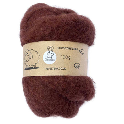 A carded wool batt in dark chocolate color, packaged in a brown paper wrap with a label that includes the product details and the brand name, The Felt Box.