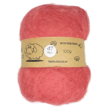 A carded pink wool batt for needle felting, displayed on a cardboard backing with a label that includes a sheep illustration and product details.