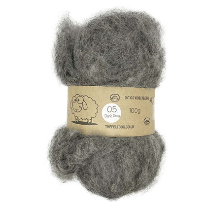 A bundle of carded NZ wool in dark grey color, intended for needle felting, displayed with a label indicating the product details.