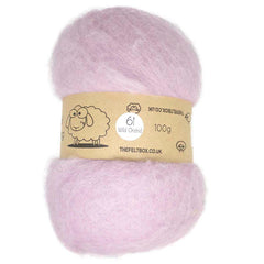 A batt of carded, pink wool fiber displayed on a card with a label that includes the brand name 'The Felt Box' and the product details.