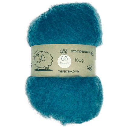 A carded blue wool batt for needle felting, Peacock #63, from The Felt Box, displayed on a card with a label.