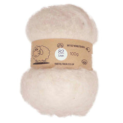A bundle of beige carded wool batting labeled '82 Linen 100g' from TheFeltBox.co.uk.