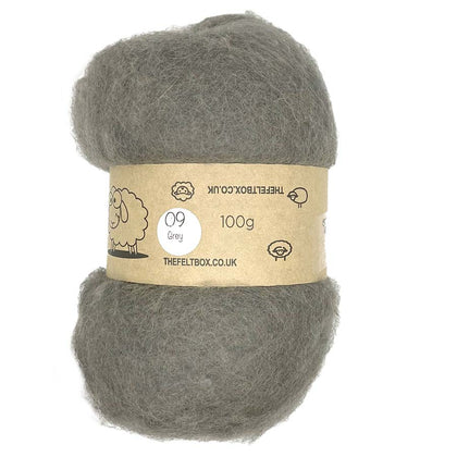 A roll of carded, mid grey wool batting for needle felting, with a label indicating 100% sheep wool and a weight of 100g.