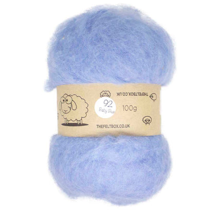 A bundle of carded baby blue wool batting, packaged with a label that indicates it is 100% New Zealand wool and 100g weight.