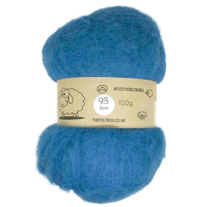 A bundle of blue carded wool batting, labeled with weight and brand information.