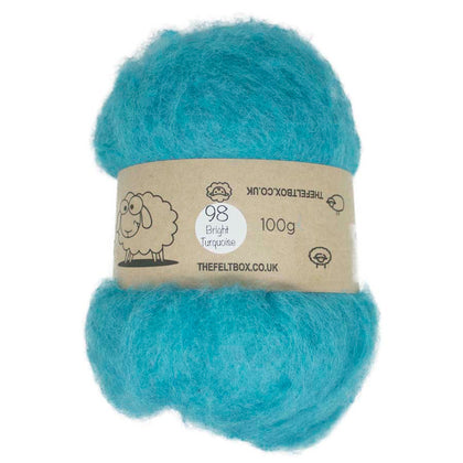 A carded wool batt in bright turquoise color, packaged in a felt box with a label.