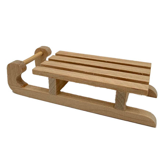 Mini wooden sledge on white background, small 65mm natural wood sled accessory for needle felting scenes and miniature displays