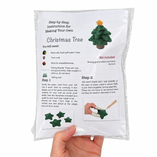 Needle felted Christmas tree held in hand - The Felt Box wool pack with instructions