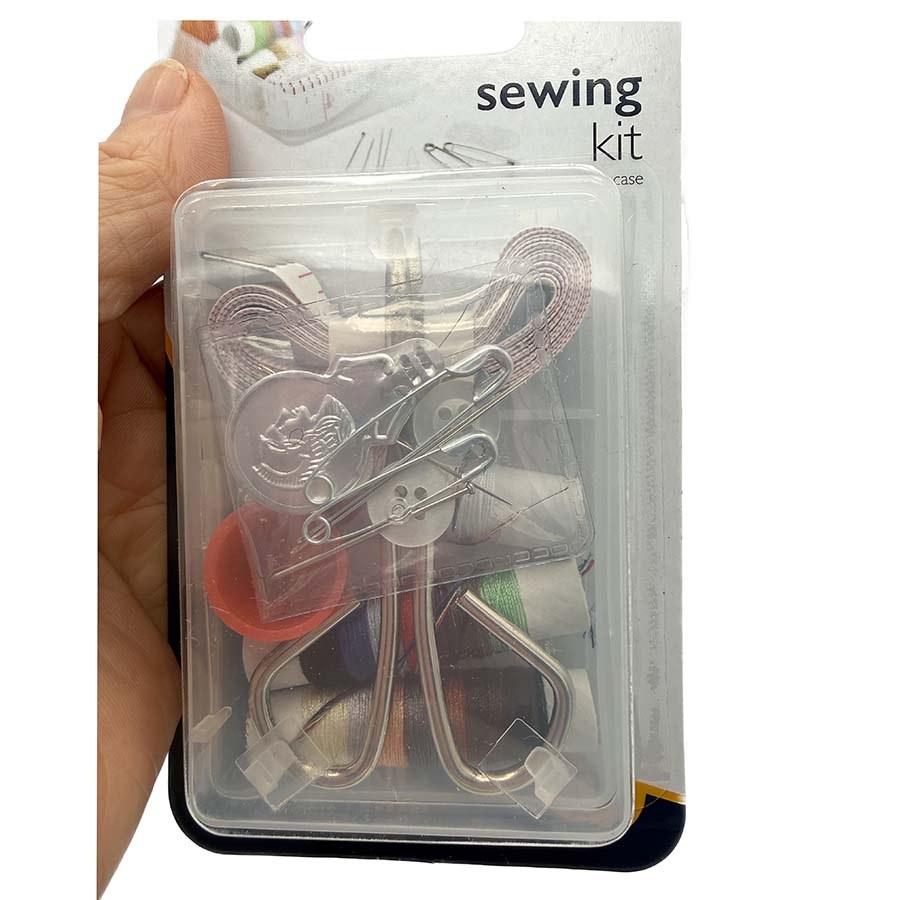 Korbond 13 piece sewing kit held in hand showing threads, scissors and thimble | The Felt Box
