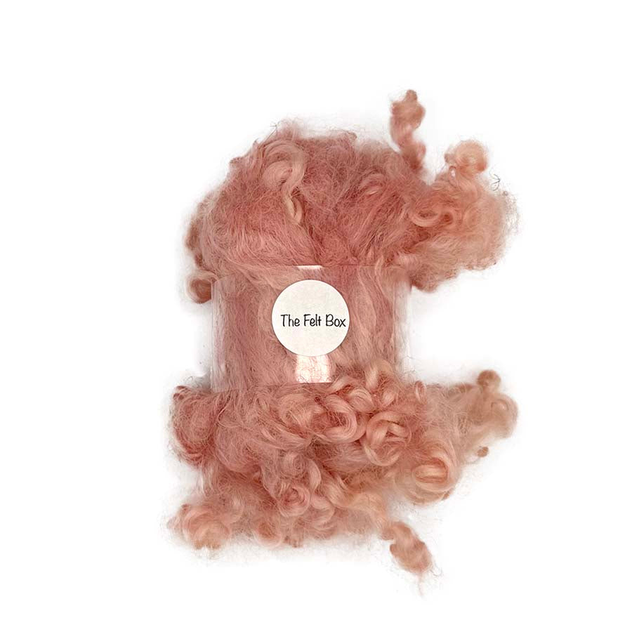 28g pack of peachy pink curly wool locks tied with The Felt Box band