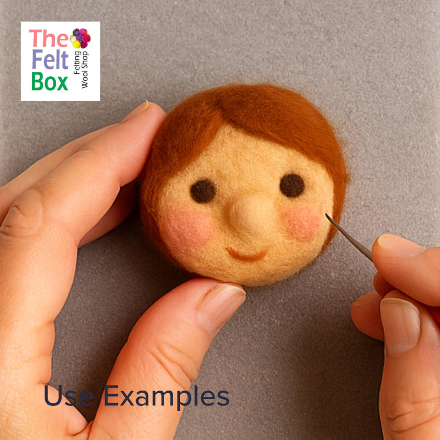 Handmade felt doll being worked on with a felting needle, featuring 'The Felt Box' brand.