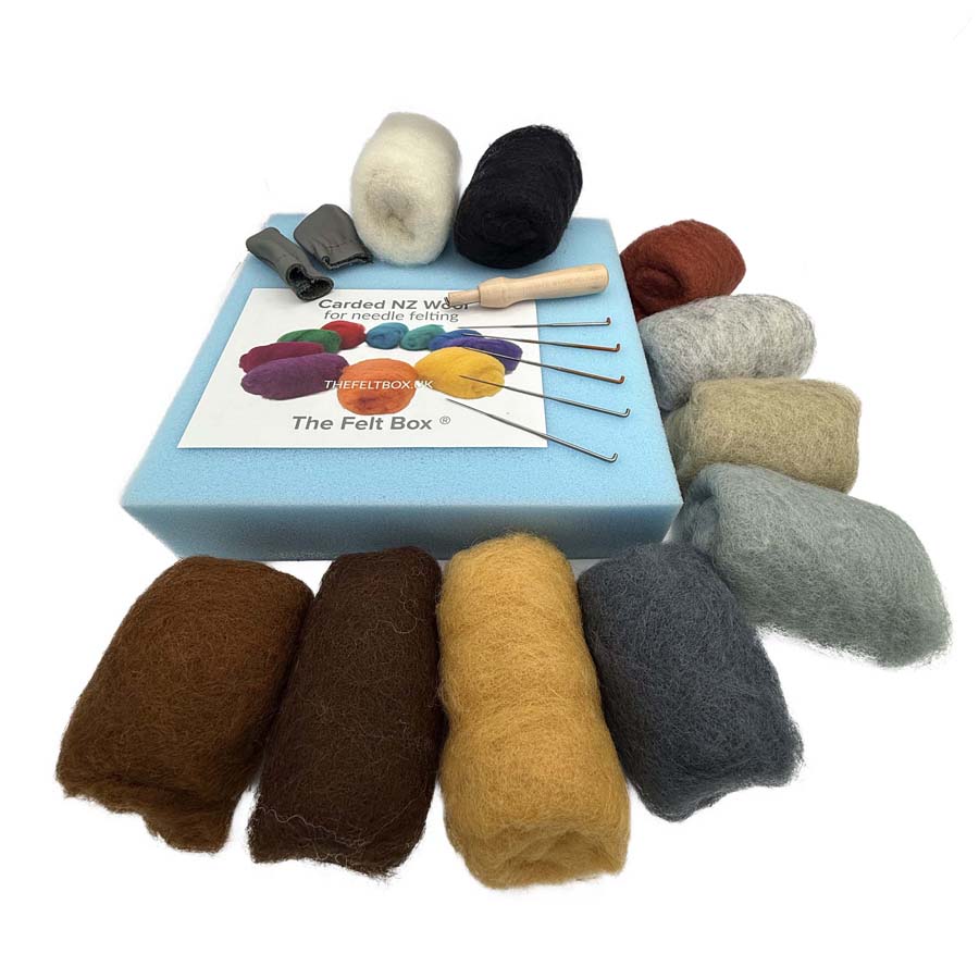 Needle felting starter kit with 10 grey, brown and cream carded wool colours, felting needles, foam mat, finger protectors and needle holder.