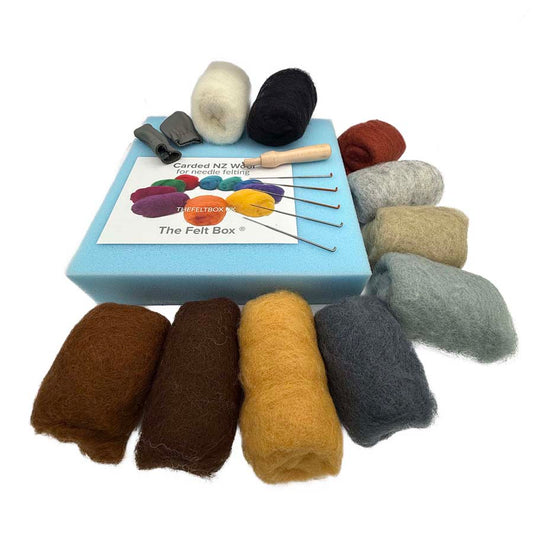 Needle felting starter kit with 10 grey, brown and cream carded wool colours, felting needles, foam mat, finger protectors and needle holder.