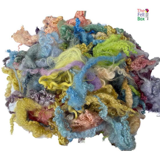 Curly hand-dyed British wool locks – perfect for needle felting, art yarn, and fibre projects. Wensleydale & BFL curls, dyed in rich colours. 50g pack