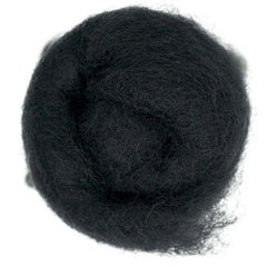 Seal – Dark grey-black shade of Maori carded wool with subtle purple undertones. 100g wool roving for needle felting, wet felting, and fibre art. Works well as a base fibre, dense core, or bold finishing layer.