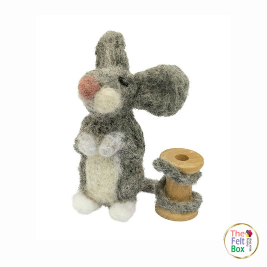 Finished needle-felted grey mouse beside a wooden cotton reel | The Felt Box