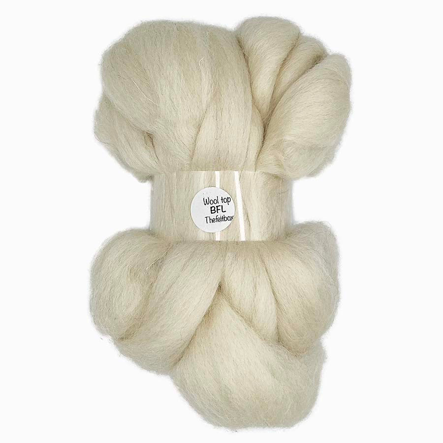 Soft cream Bluefaced Leicester wool top with a smooth, lustrous texture, ideal for spinning and needle felting