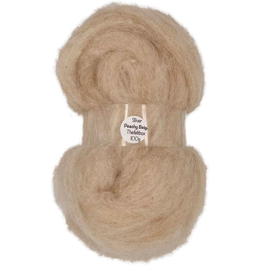 Ball of beige yarn with a label on a white background